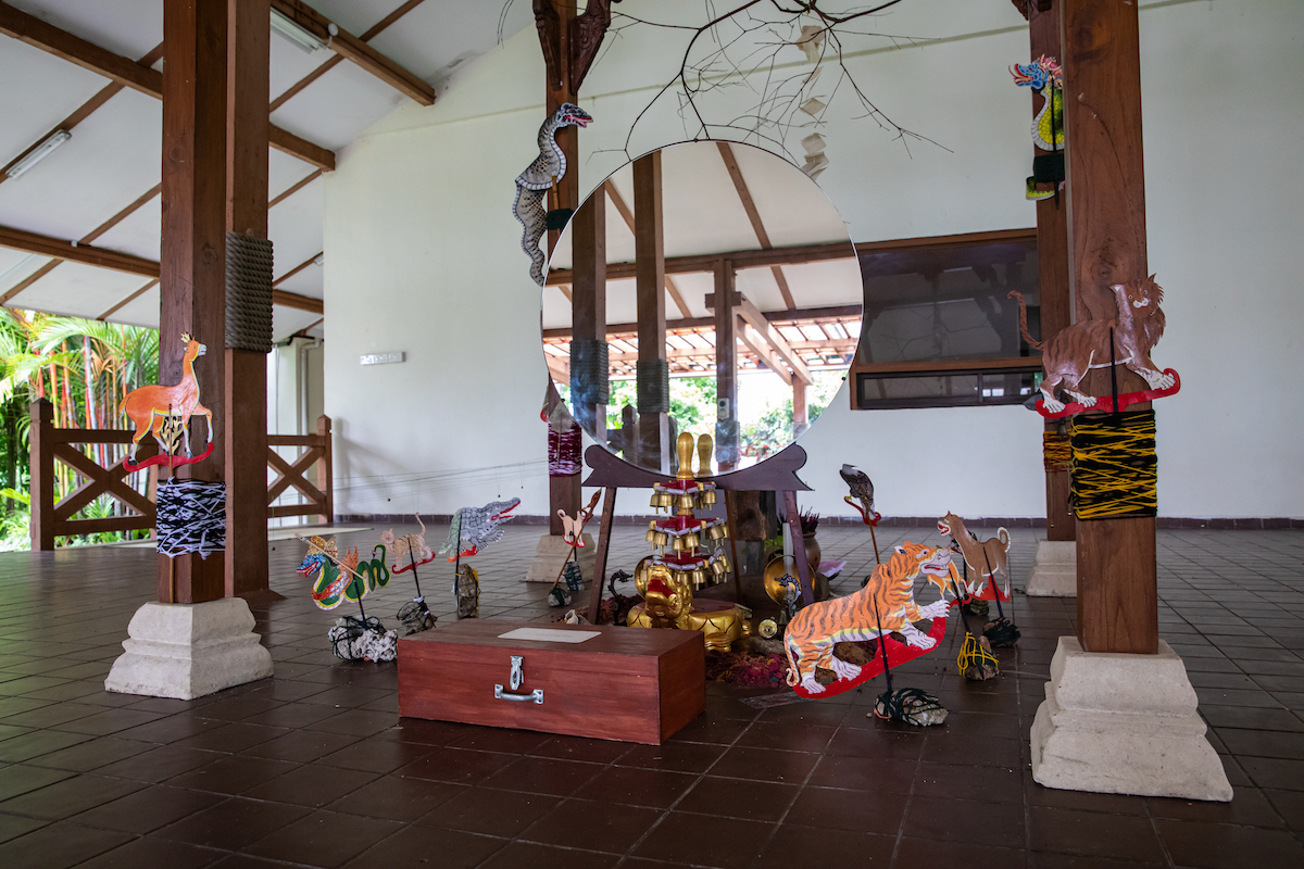 Installation-view-of-Zarina-Muhammads-Moving-Earth-Crossing-Water-Eating-Soil-2022-as-part-of-Singapore-Biennale-2022-named-Natasha.-Image-courtesy-of-Singapore-Art-Museum-1